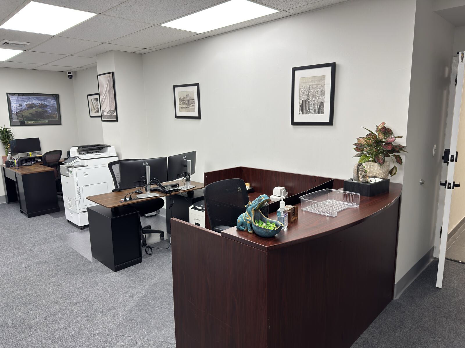 Inside the Verma Tax and Accounting Solutions office in Smithtown, NY — reception desk and workstations